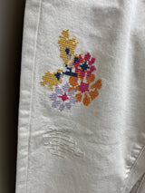 Tribal ecru cross stitch floral fray hem jeans