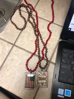 Beads with framed pendant