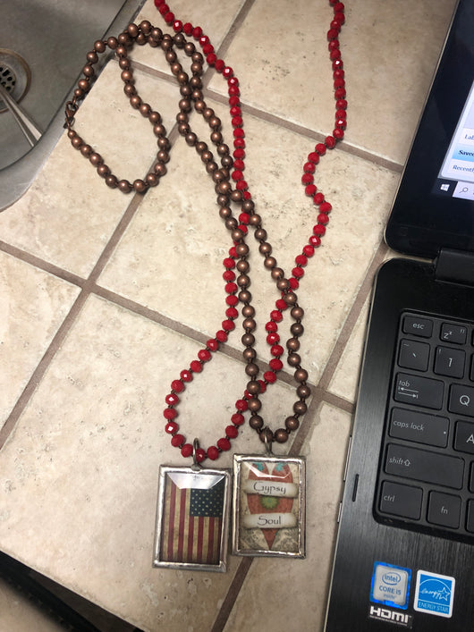 Beads with framed pendant